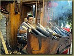 cooking rice in bamboo.JPG