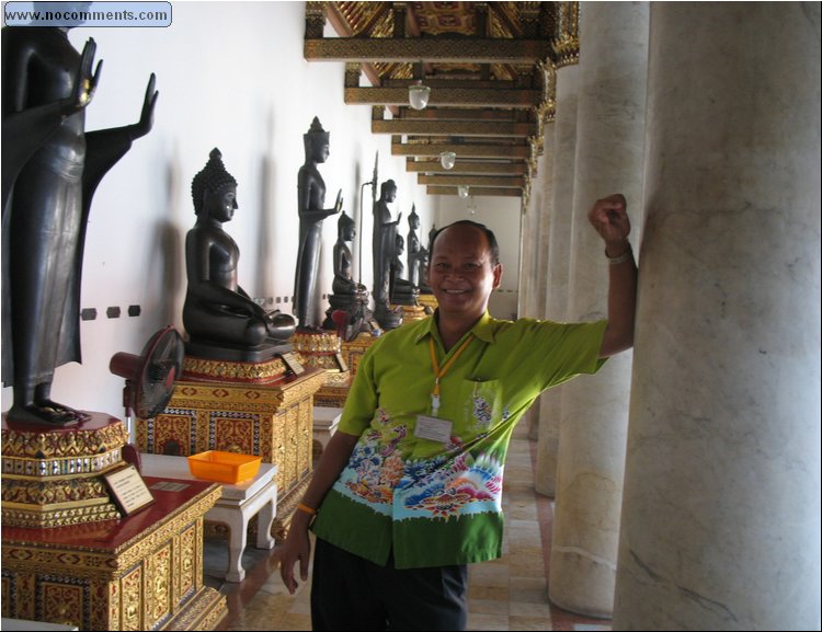 Marble Temple Our guide Tan in cloister where 53 bronze buddhas.jpg